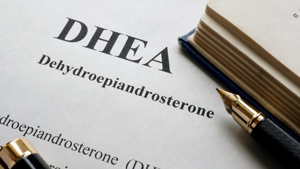 DHEA spelled out on a document with an ink pen off to the side